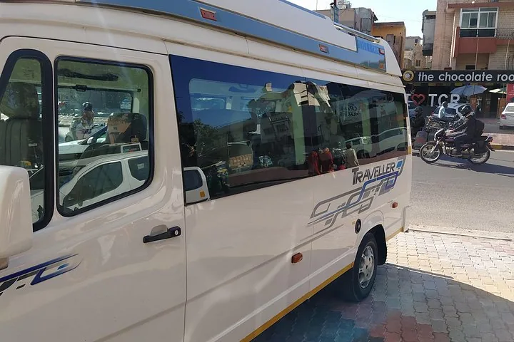 A white 'Traveller' van parked on a street